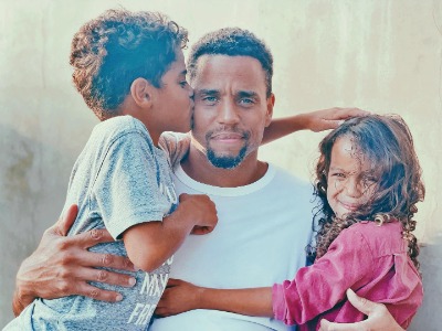 Khatira Rafiqzada's beau, Michael Ealy, carries their two children.